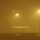 An aircraft parks in heavy haze at Beijing airport on January 28, 2013.